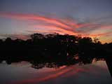 Sunset reflected in the moat of Angkor Wat