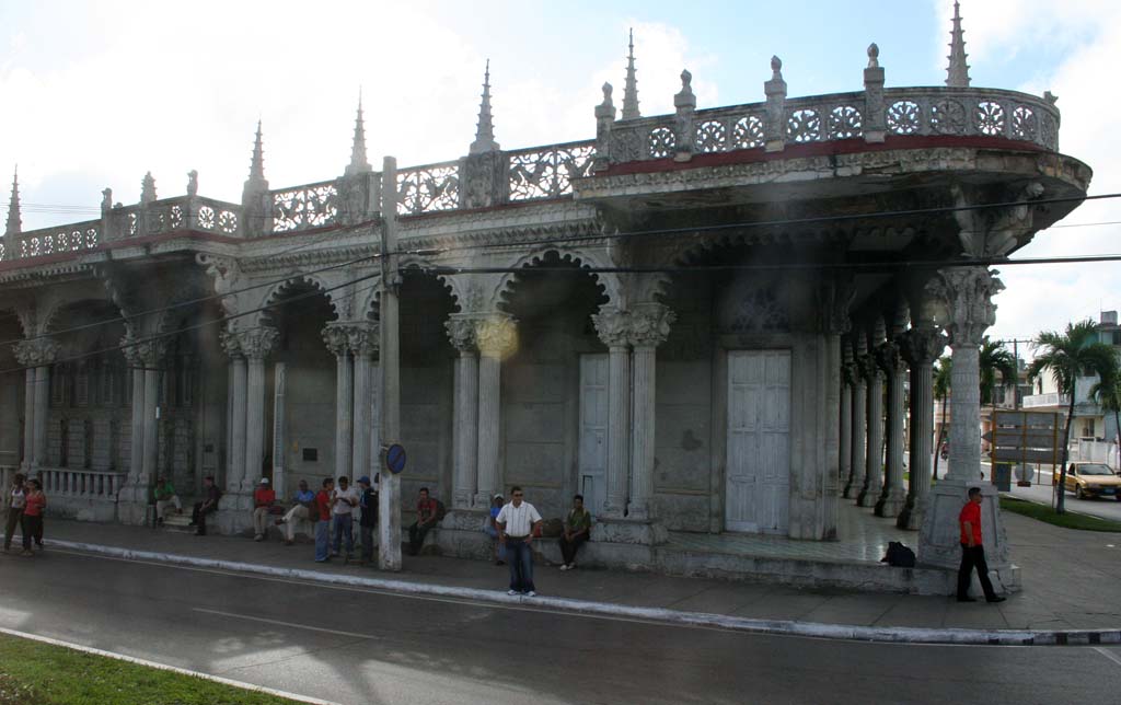 A very ornate, colonnaded colonial building.