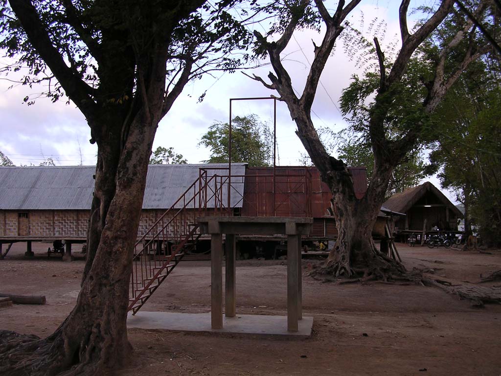 The platform - pulpit? in the middle of the village. What could it be for?