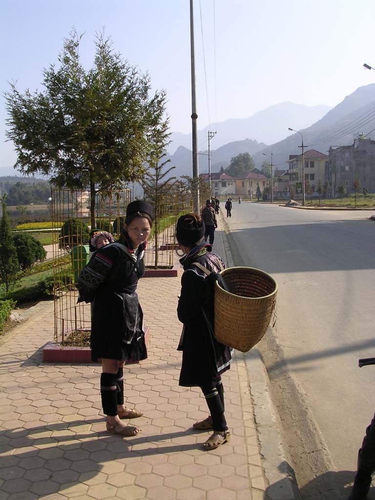 Two H'mong women: one with basket, one with baby
