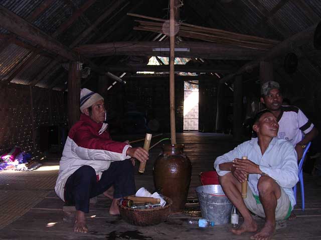Vietnam: Central Highlands with the Easy Riders - Lak: drinking rice wine in a long house