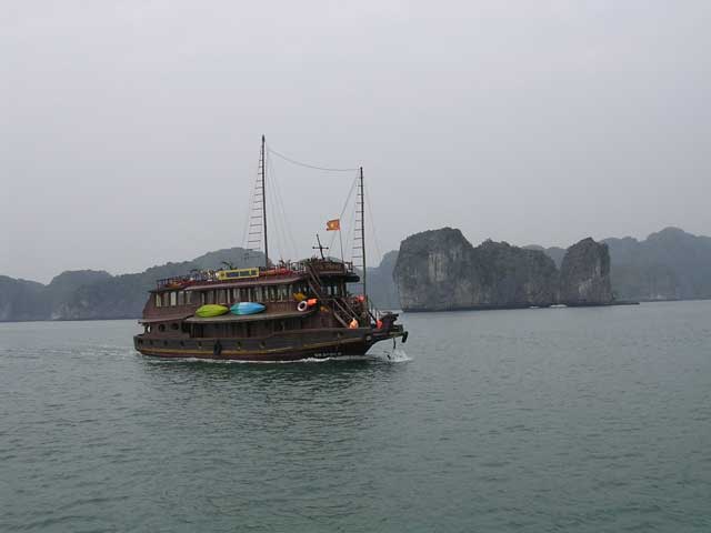 Vietnam: Ha Long Bay - one of the many tourist boats cruising around the bay